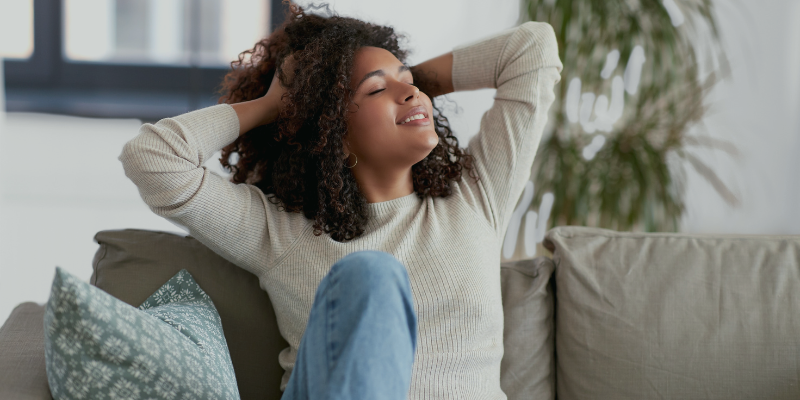 Relaxed woman releasing victimhood during a recorded Light-Language session.